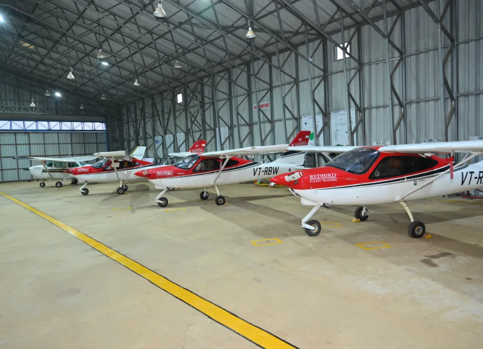 Redwings training aircraft parked in the hangar at the Bhopal campus